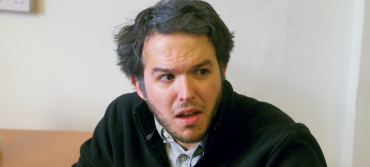 Screenshot of The L's course leader, Lyle, played by Diego Zozaya, looking horrified in episode two of The L's.
